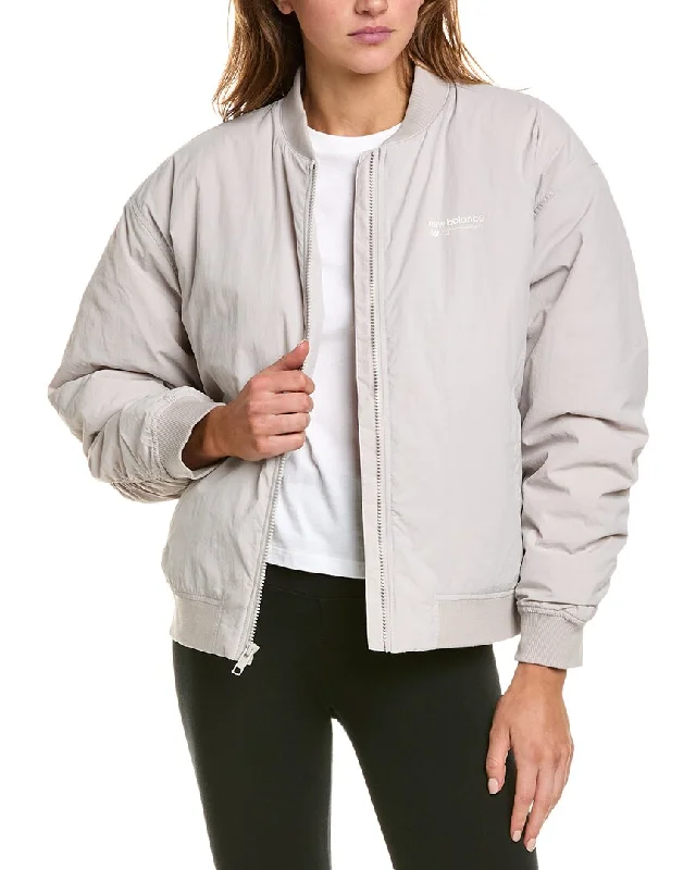 Hooded women's puffer coats in neon colors for high - visibility sportsNew Balance Jacket