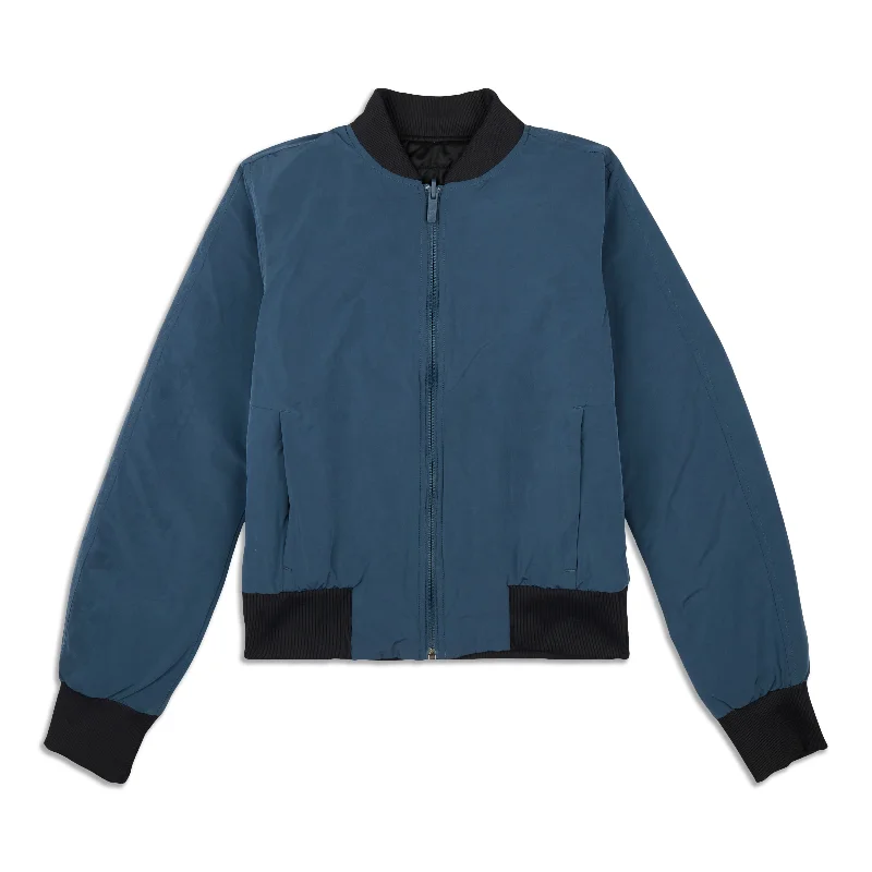 Hooded women's puffer coats in neon colors for high - visibility sportsNon Stop Bomber