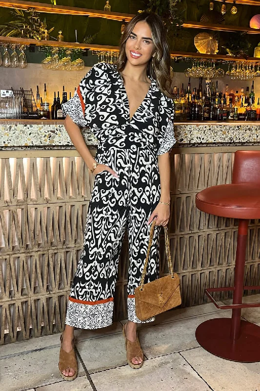 Ruffled women jumpsuits with a feminine touch for a date nightBlack And Cream V-Neck Jumpsuit Ruffled women jumpsuits with a feminine touch for a date nightBlack And Cream V-Neck Jumpsuit