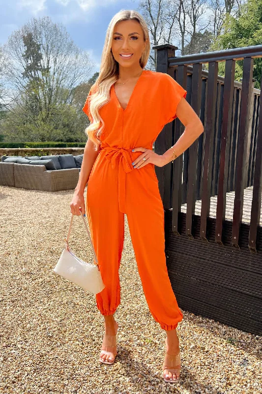 Women jumpsuits with side slits on the pants for a touch of allureBurnt Orange V Neck Short Sleeve Belted Elasticated Cuff Jumpsuit Women jumpsuits with side slits on the pants for a touch of allureBurnt Orange V Neck Short Sleeve Belted Elasticated Cuff Jumpsuit