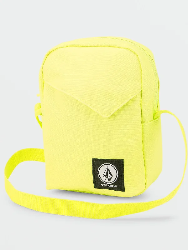 Women's cropped down jackets in bold colors for a sporty and fashionable winter outfitVolcom Cross-Body Stash Bag - Lime Women's cropped down jackets in bold colors for a sporty and fashionable winter outfitVolcom Cross-Body Stash Bag - Lime