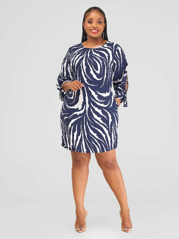 Mini dresses with pom - pom trims for a playful feelSalok Havilah Gulu Dress - Navy Blue Print Mini dresses with pom - pom trims for a playful feelSalok Havilah Gulu Dress - Navy Blue Print