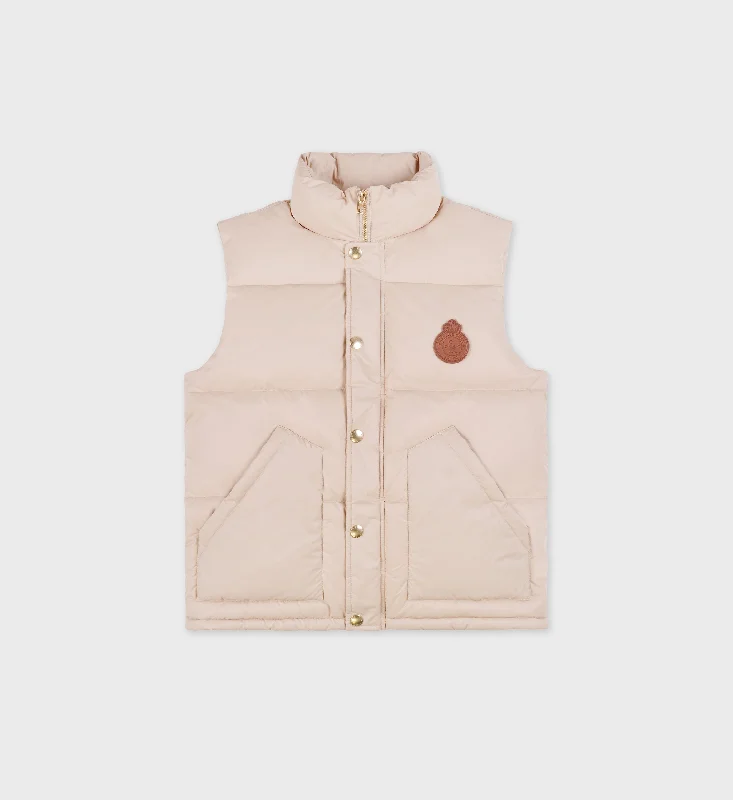 Women's cropped leather coats with silver studs for an edgy lookCrown Puffer Vest - Cream Women's cropped leather coats with silver studs for an edgy lookCrown Puffer Vest - Cream